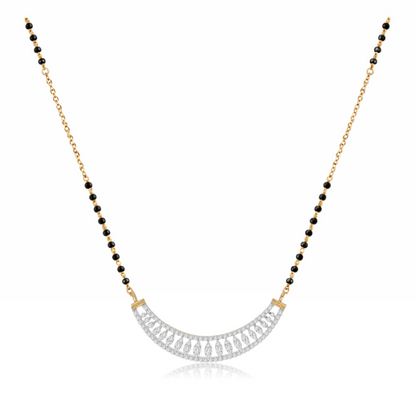A gold and black beaded necklace with a curved silver-toned pavé pendant, displayed on a clean white background.