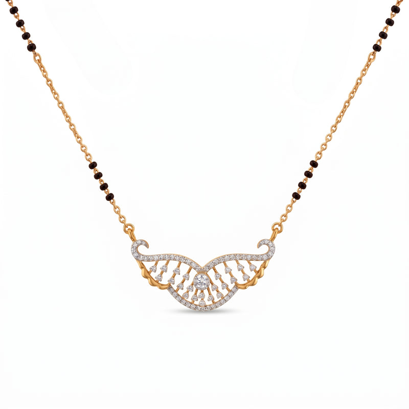 A gold and white stone necklace featuring a wing-like pavé pendant with a central clear stone, suspended from a chain with alternating gold and dark brown beads, on a white background.