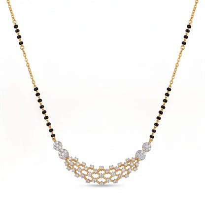 A gold and black beaded necklace with a curved diamond-patterned pendant, displayed on a clean white background.