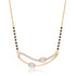 A gold necklace with a curved bar pendant set with small clear stones, and a beaded chain featuring alternating black and gold beads, shown on a white background with a soft reflection.