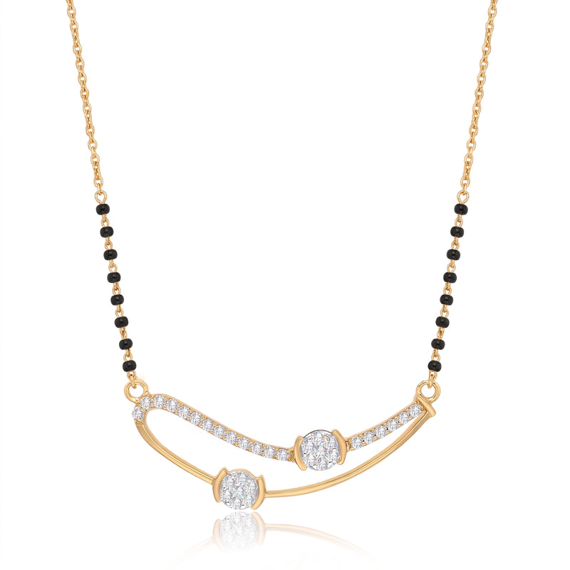 A gold necklace with a curved bar pendant set with small clear stones, and a beaded chain featuring alternating black and gold beads, shown on a white background with a soft reflection.