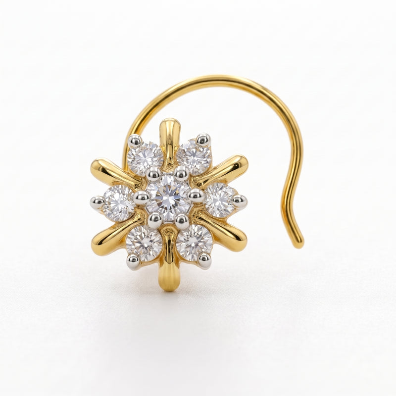 A gold flower-shaped nose ring with a curved post and multiple clear gemstones set in polished yellow gold, shown on a plain white background.
