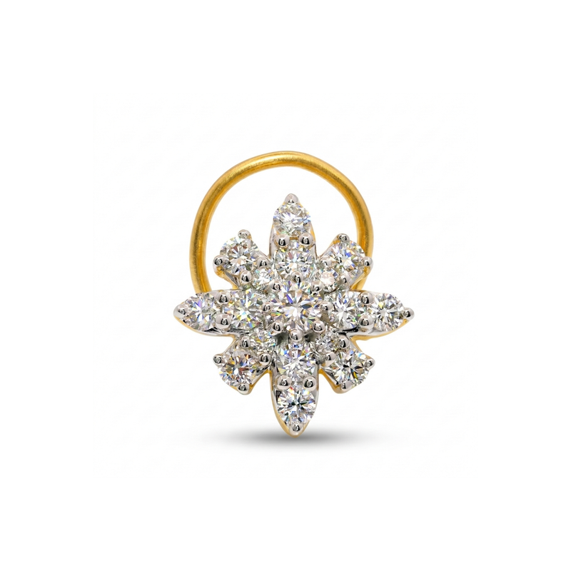 Gold and diamond nose ring on a white background