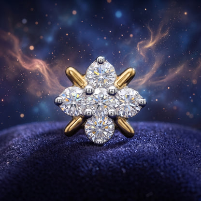 A six-stone diamond cluster nose ring with a gold and silver-toned halo setting, displayed on a textured dark blue surface against a cosmic, starry background.