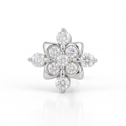 A silver-tone flower-shaped ring featuring multiple round and marquise-cut clear gemstones, set against a clean white background with a soft reflection.