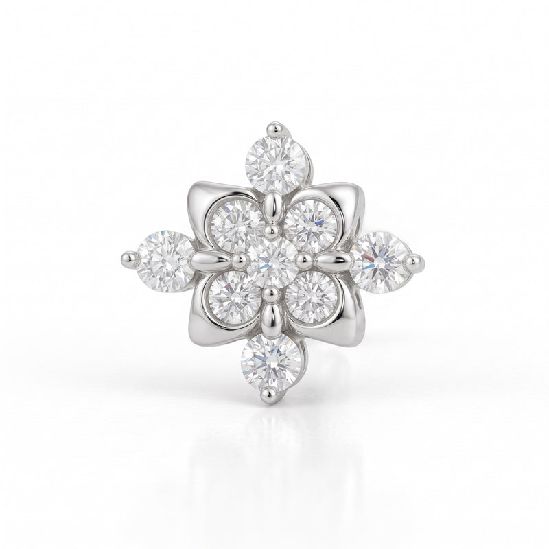 A silver-tone flower-shaped ring featuring multiple round and marquise-cut clear gemstones, set against a clean white background with a soft reflection.