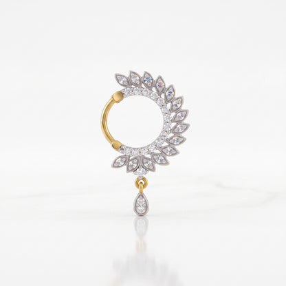 A single gold and silver hoop nosepin adorned with clear pavé gemstones, featuring a circular halo with leaf-like teardrop details and a dangling teardrop charm, set against a clean white background.