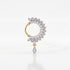 A single gold and silver hoop nosepin adorned with clear pavé gemstones, featuring a circular halo with leaf-like teardrop details and a dangling teardrop charm, set against a clean white background.