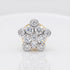 A cluster nosepin featuring multiple round brilliant-cut diamonds set in a silver-toned metal with a hint of yellow gold on the band, shown on a reflective white surface.