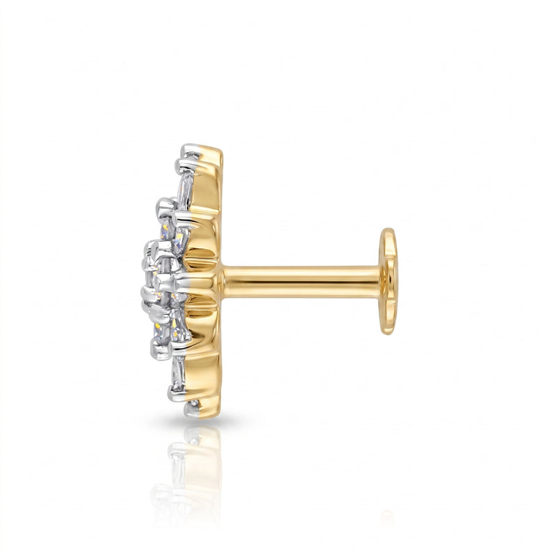 Side view of a  single gold and white gold stud nose pin shown from the side on a clean white background with a soft reflection below.