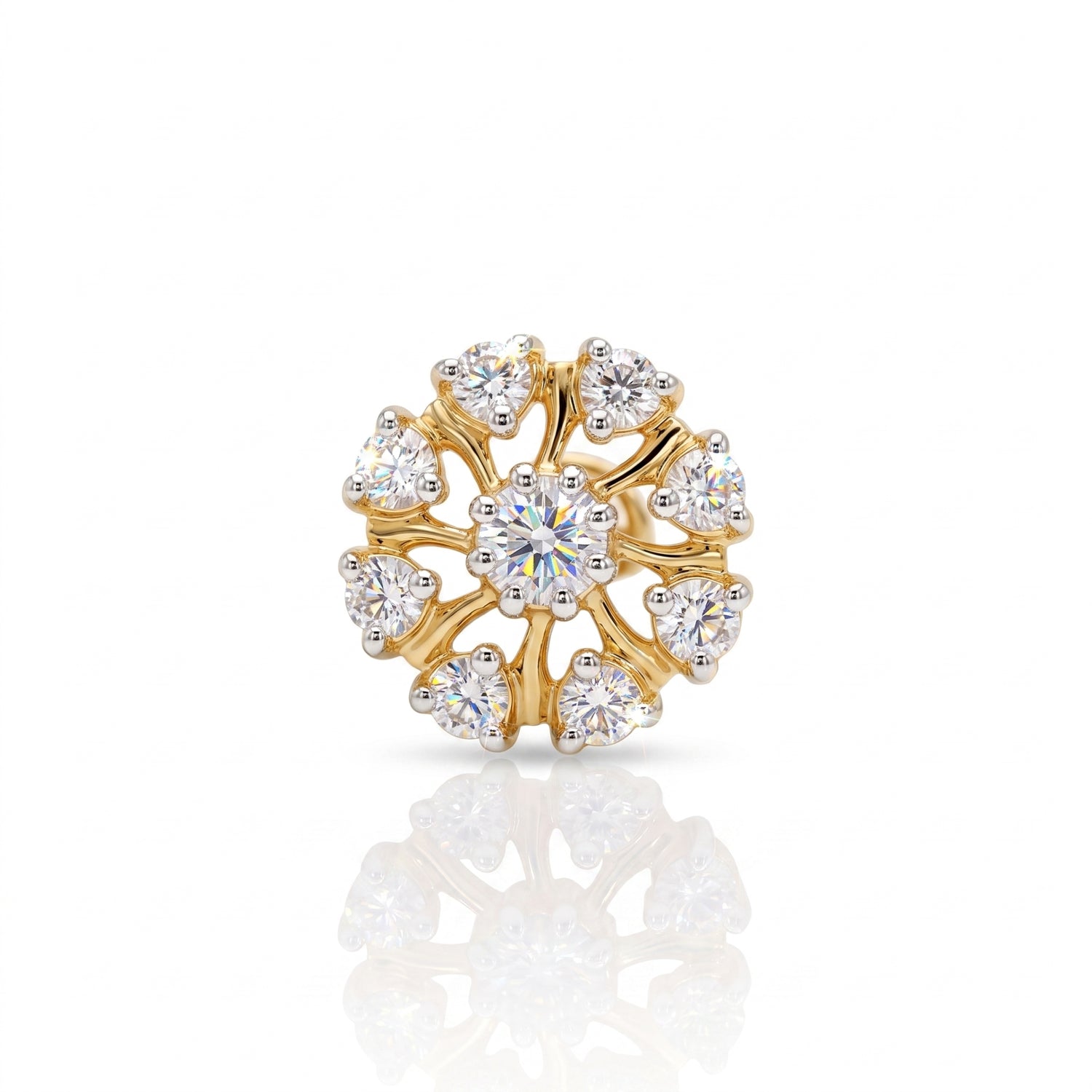 A gold flower-shaped ring with a central round brilliant-cut diamond and surrounding smaller round and heart-shaped diamonds, displayed on a clean white background with a soft reflection below.