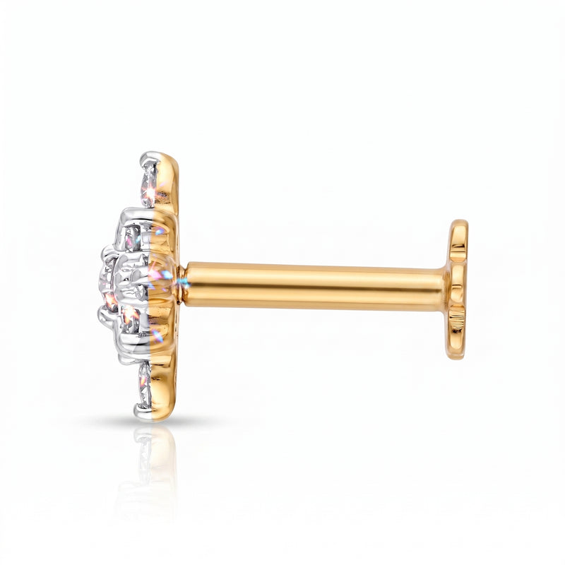 A single gold and silver stud earring with a clear gemstone cluster, shown from a side profile view on a white background.