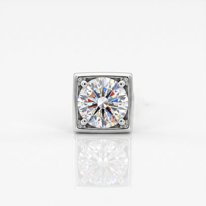 A square-cut diamond solitaire ring in a silver-toned metal setting, centered on a clean white background with a soft reflection below.