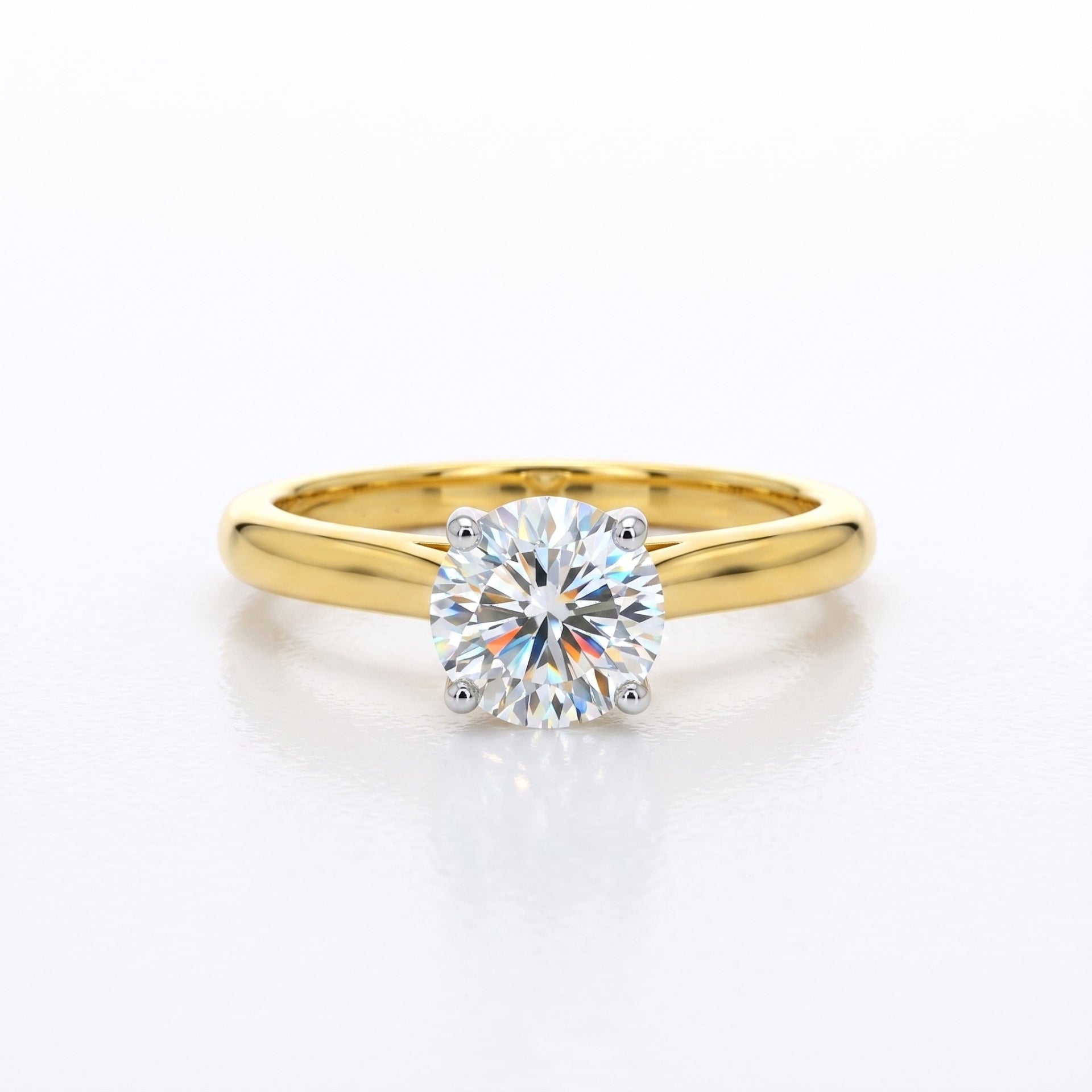Gold ring with a diamond on a white background
