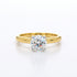 Gold ring with a diamond on a white background