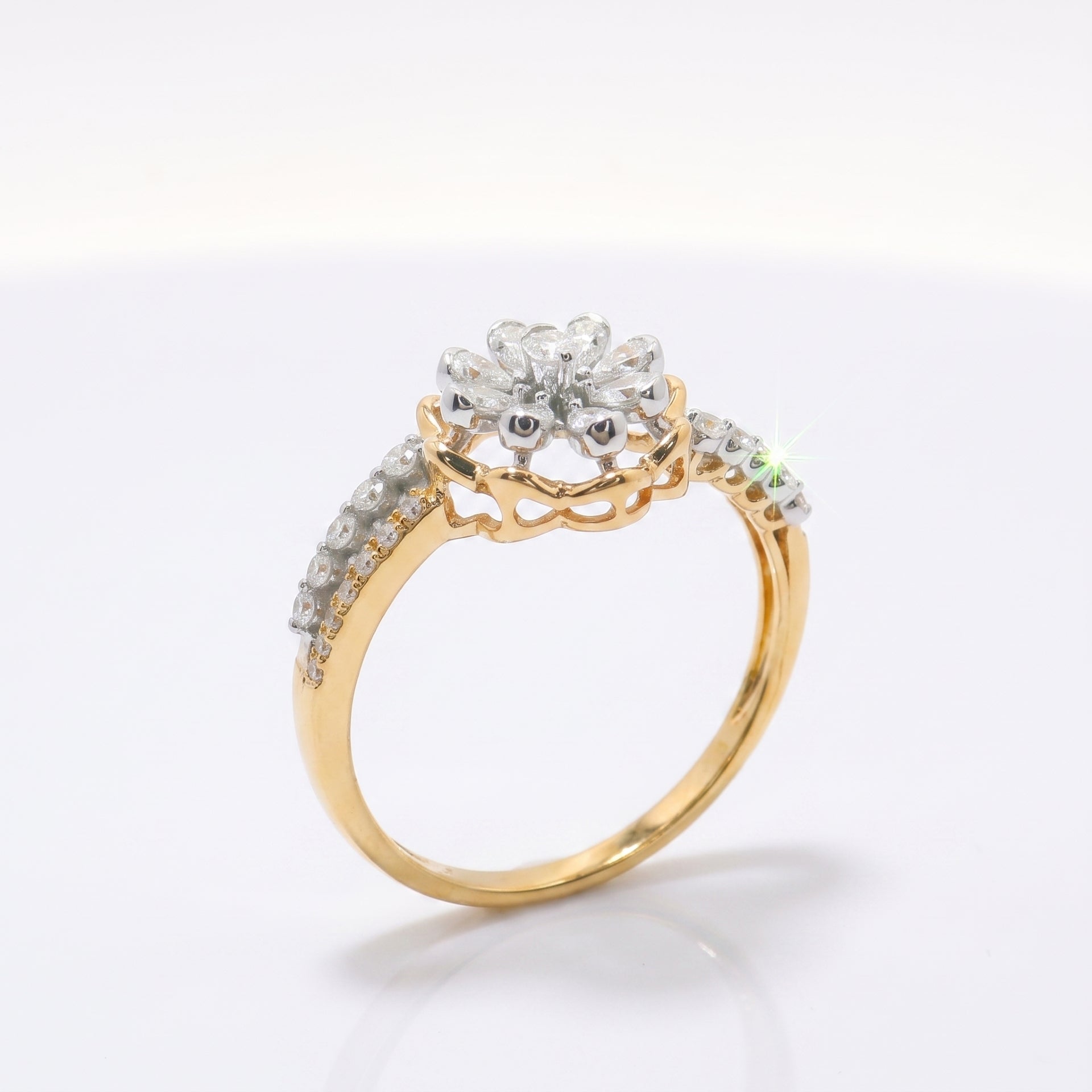 Gold ring with diamond accents on a white background