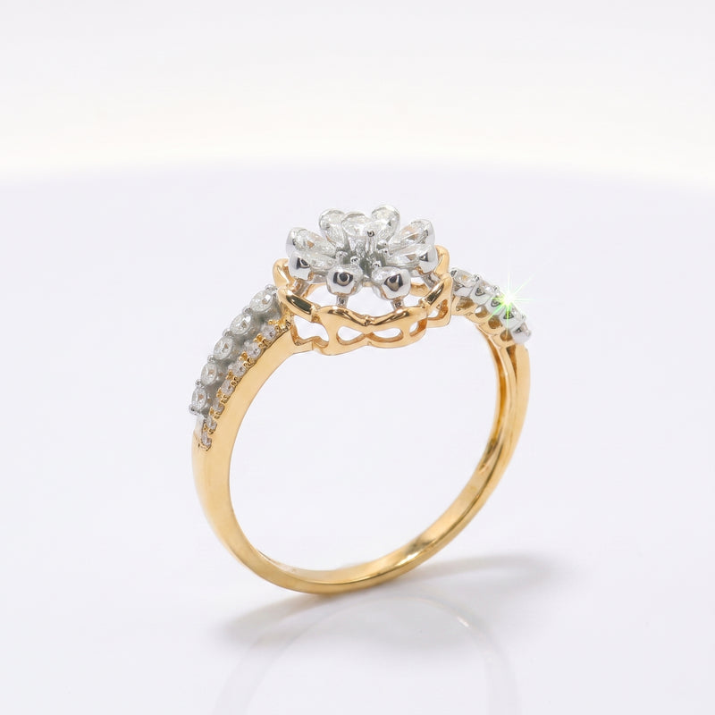 Gold ring with diamond accents on a white background