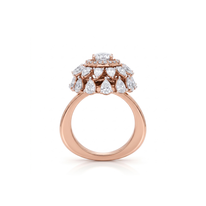 Rose gold ring with diamond teardrop design on a white background