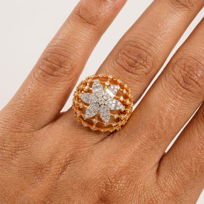 Gold ring with floral design on a person&