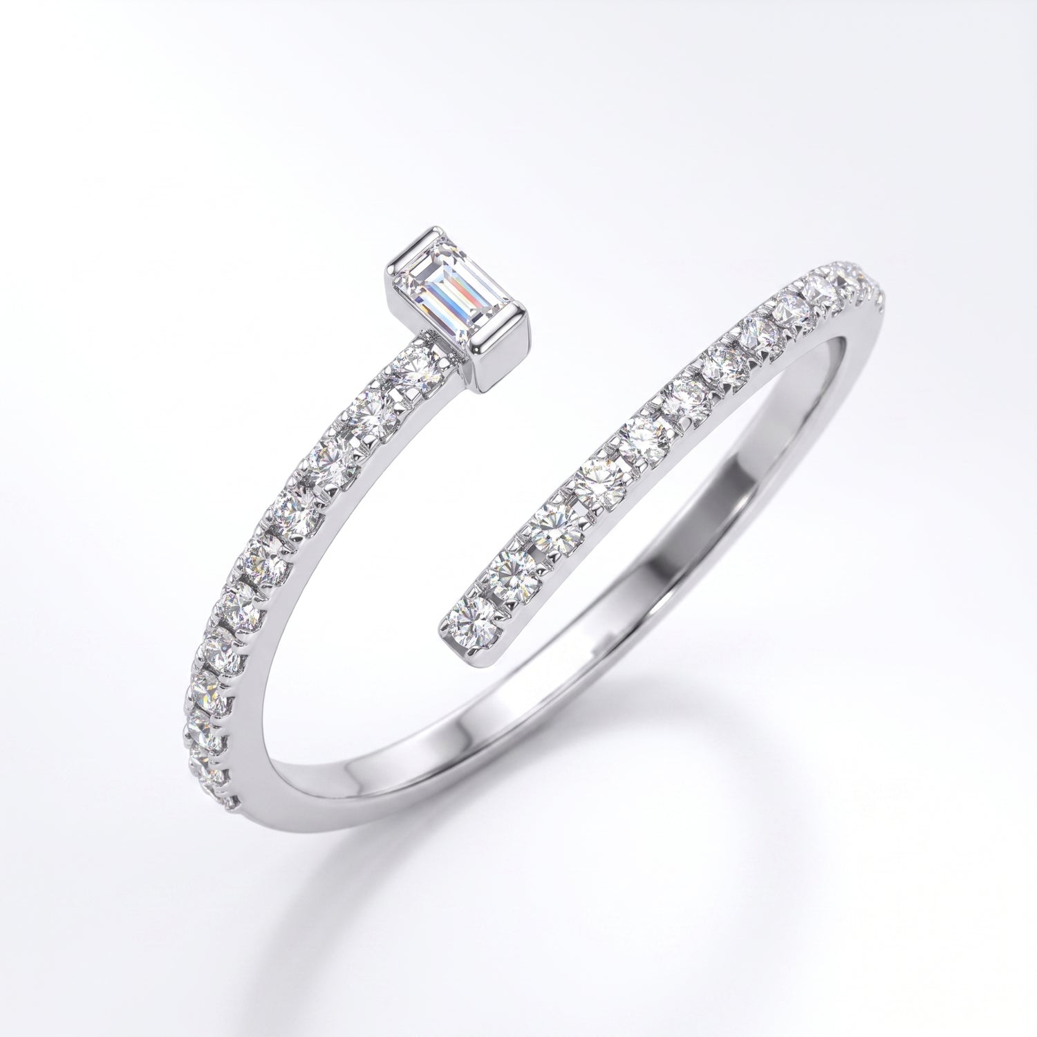 Silver open ring with diamond accents on a white background