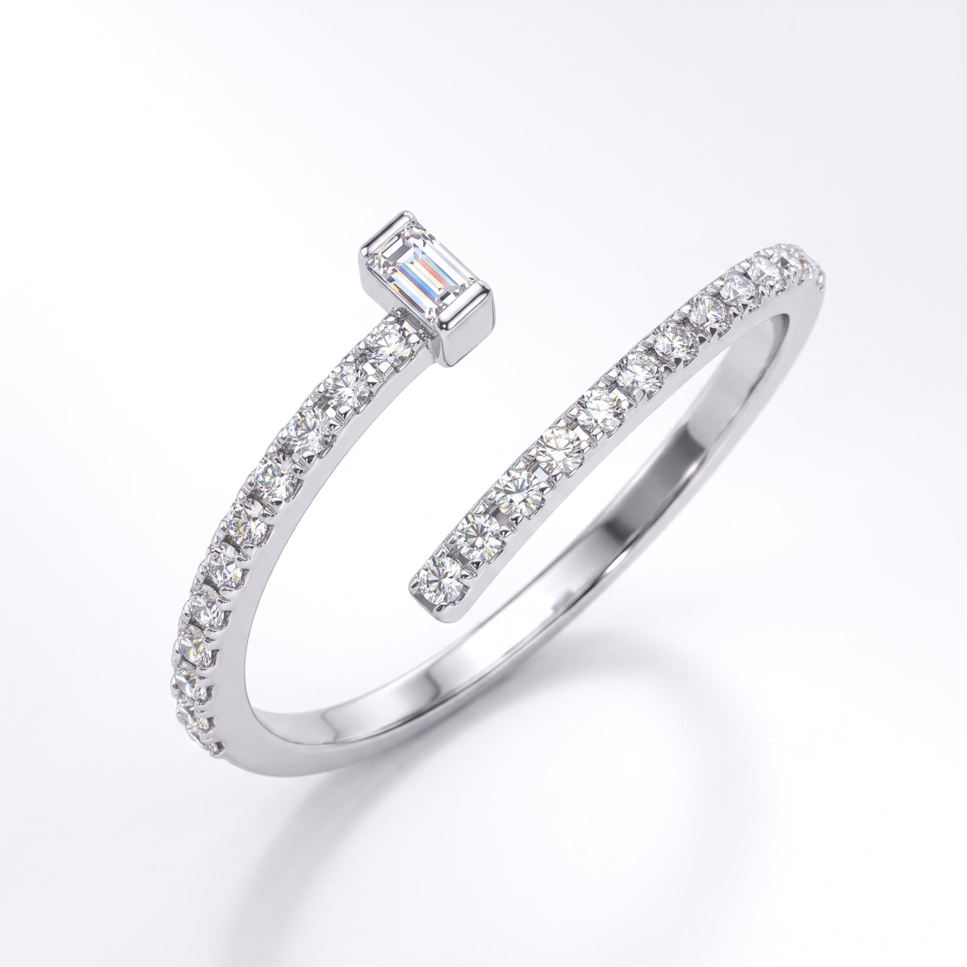 Silver open ring with diamond accents on a white background