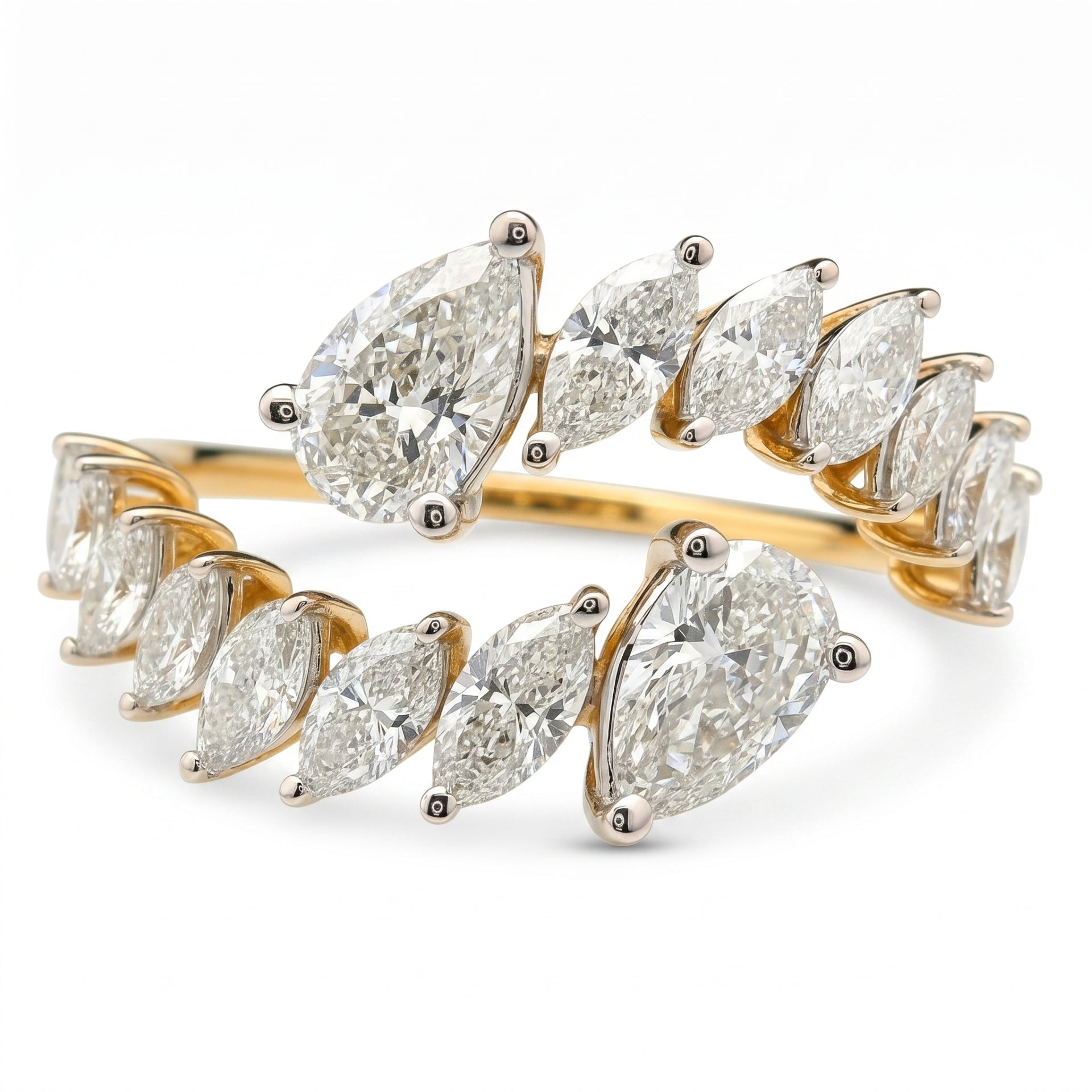 Open wrap-style gold ring featuring marquise and pear-shaped lab-grown diamonds with a white background