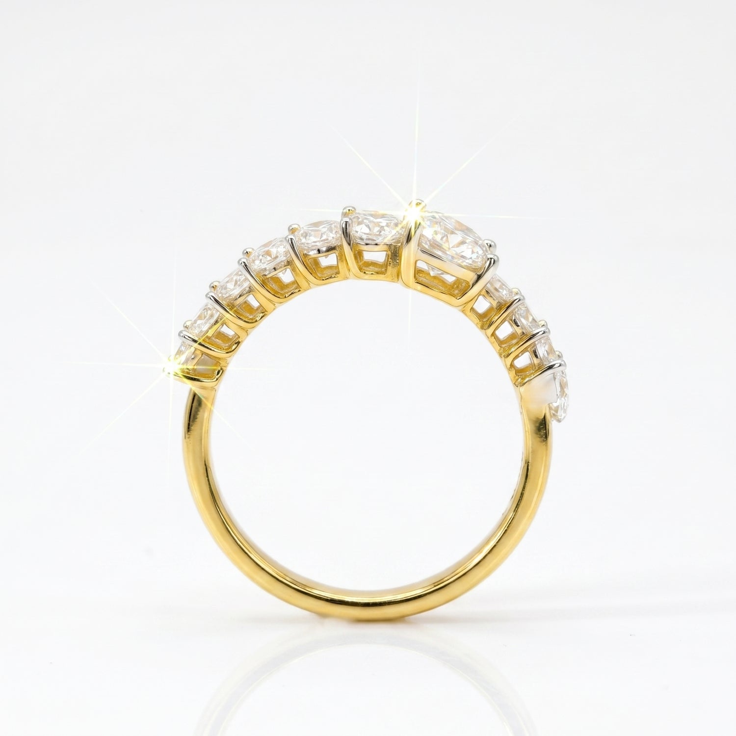 Gold ring with diamonds on a white background