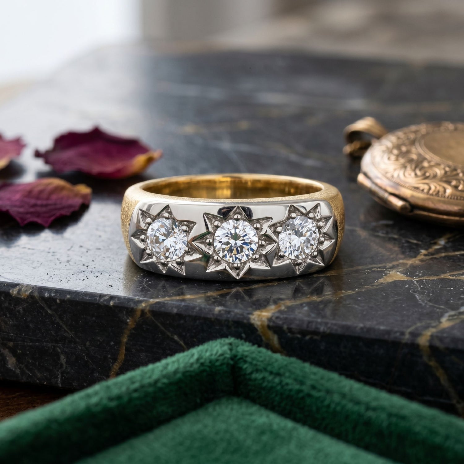Elegant gold ring with a sparkling lab-grown diamond displayed on a marble surface with decorative accents.