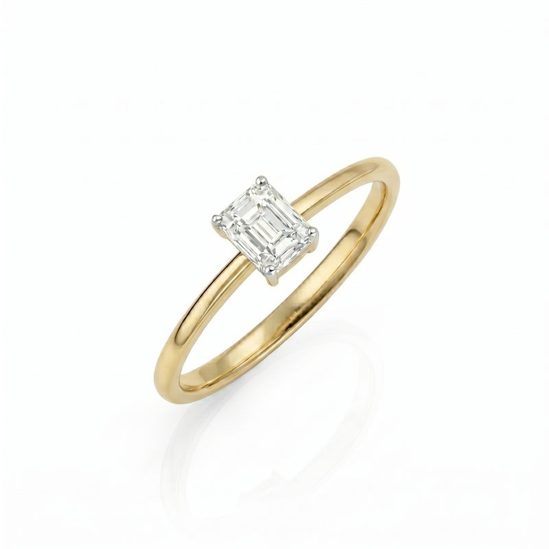 Gold ring with a diamond on a white background