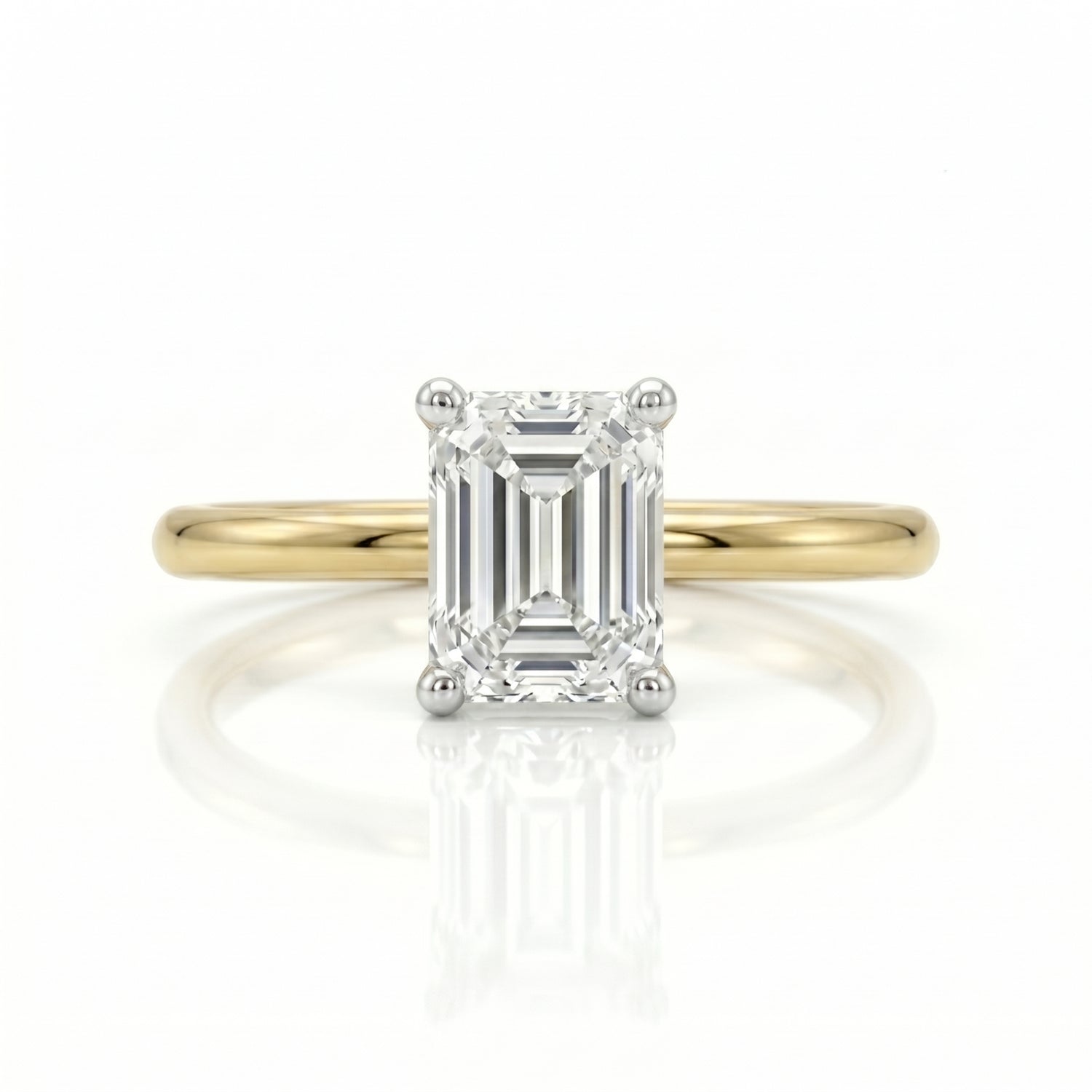 Gold ring with a diamond on a white background