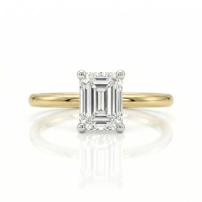 Gold ring with a diamond on a white background