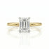 Gold ring with a diamond on a white background