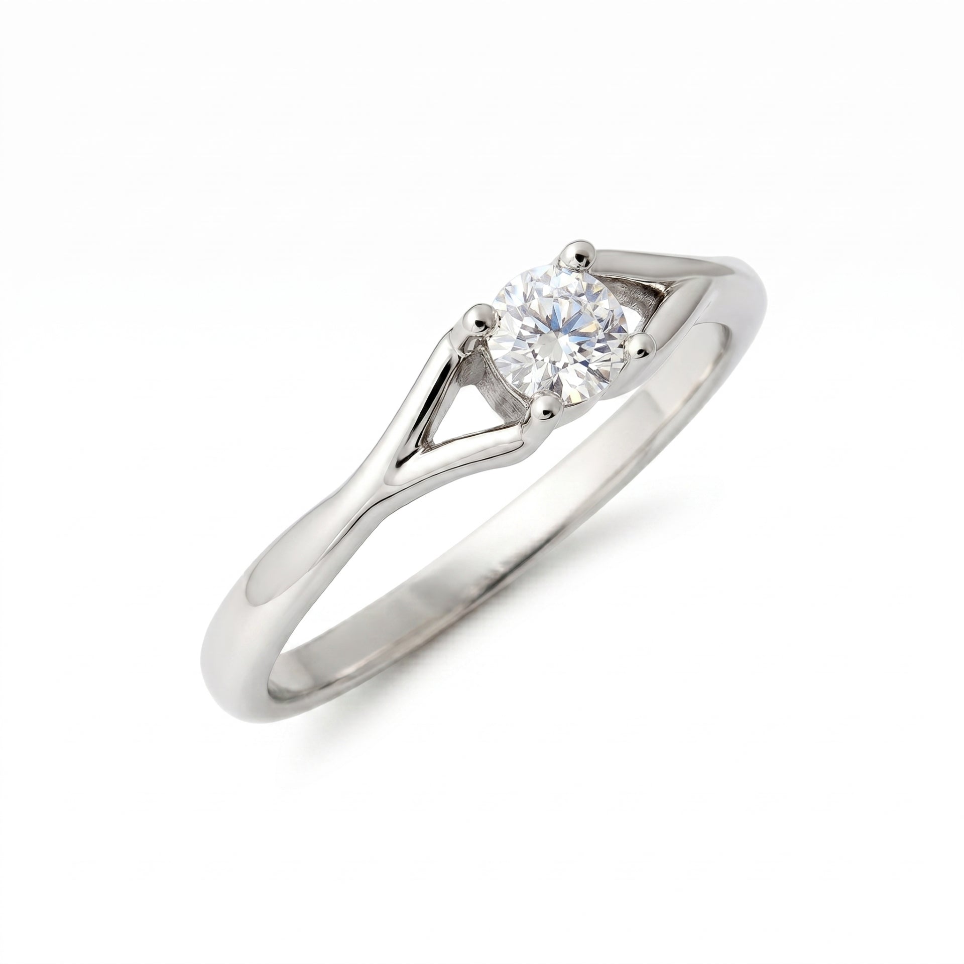 Elegant solitaire ring featuring a round lab-grown diamond on a white background.
