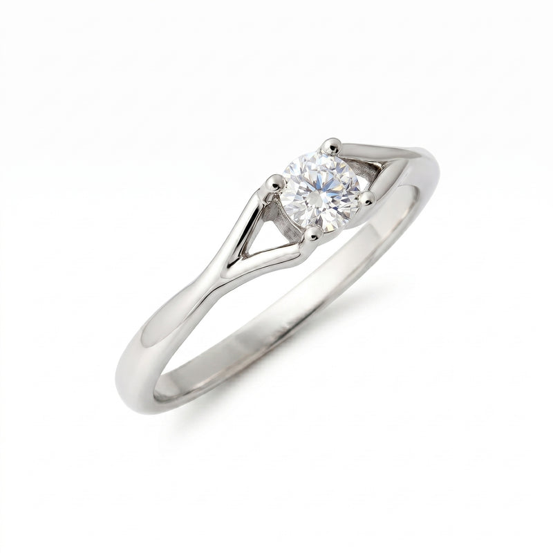 Elegant solitaire ring featuring a round lab-grown diamond on a white background.