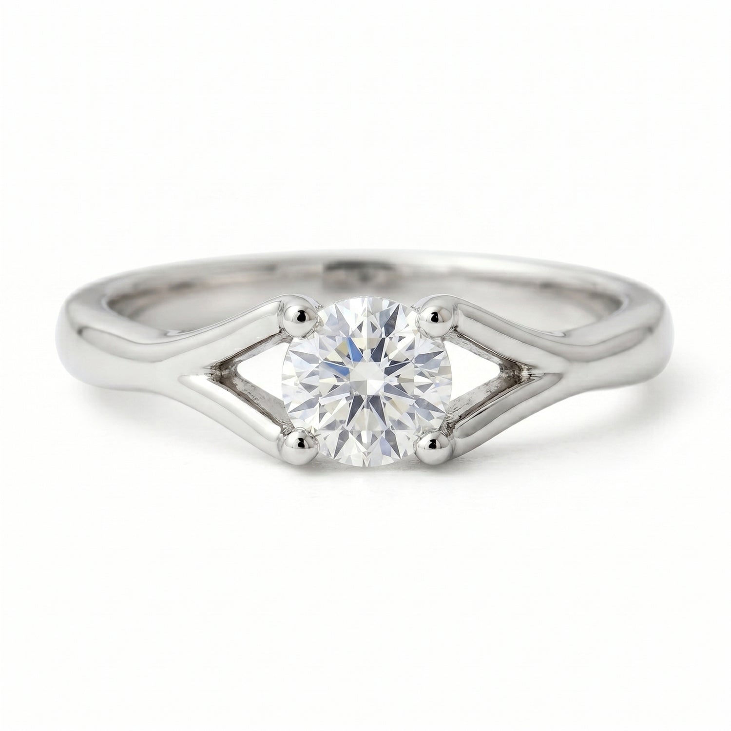 Classic solitaire ring featuring a round lab-grown diamond on a white background.