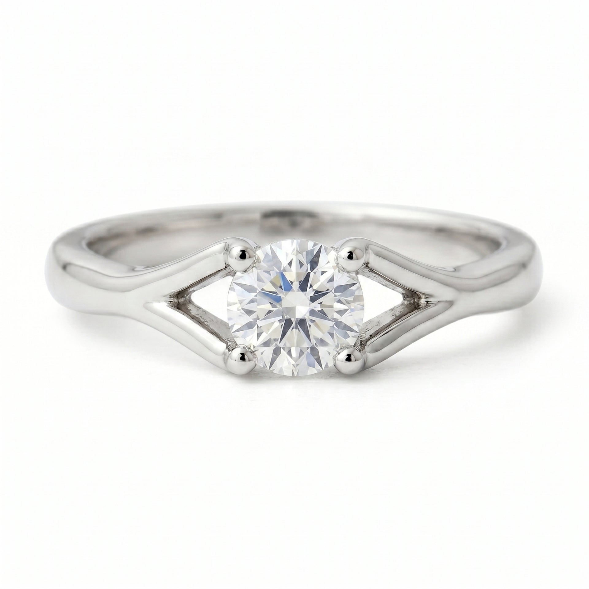 Classic solitaire ring featuring a round lab-grown diamond on a white background.