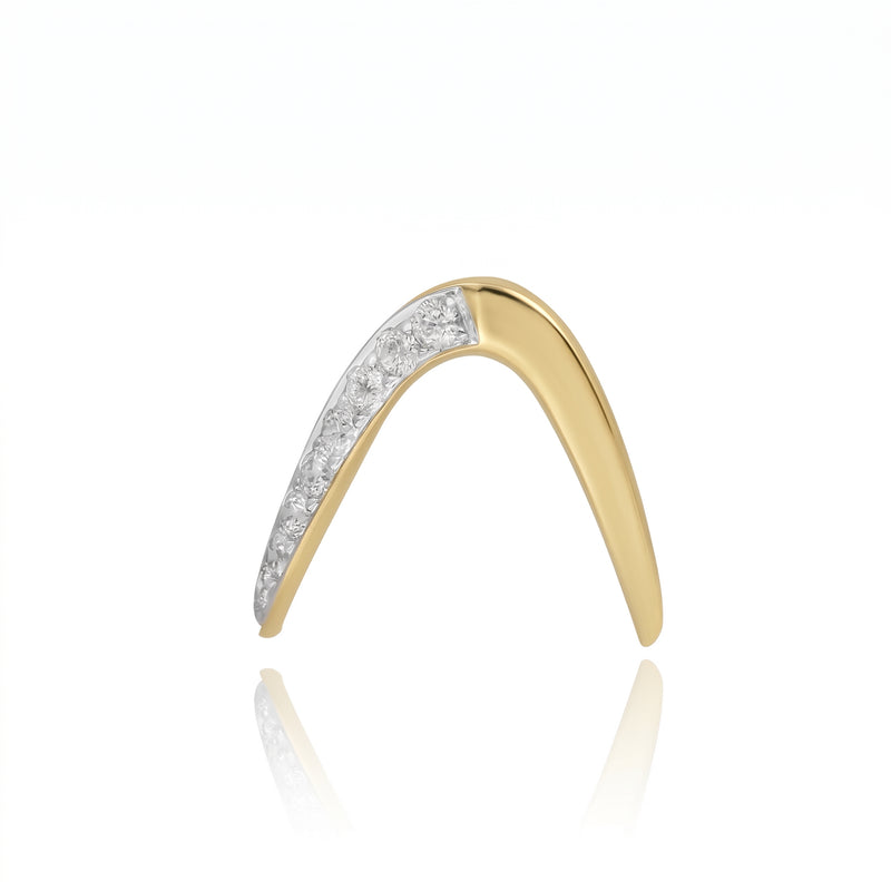 Gold ring with diamond accents on a white background