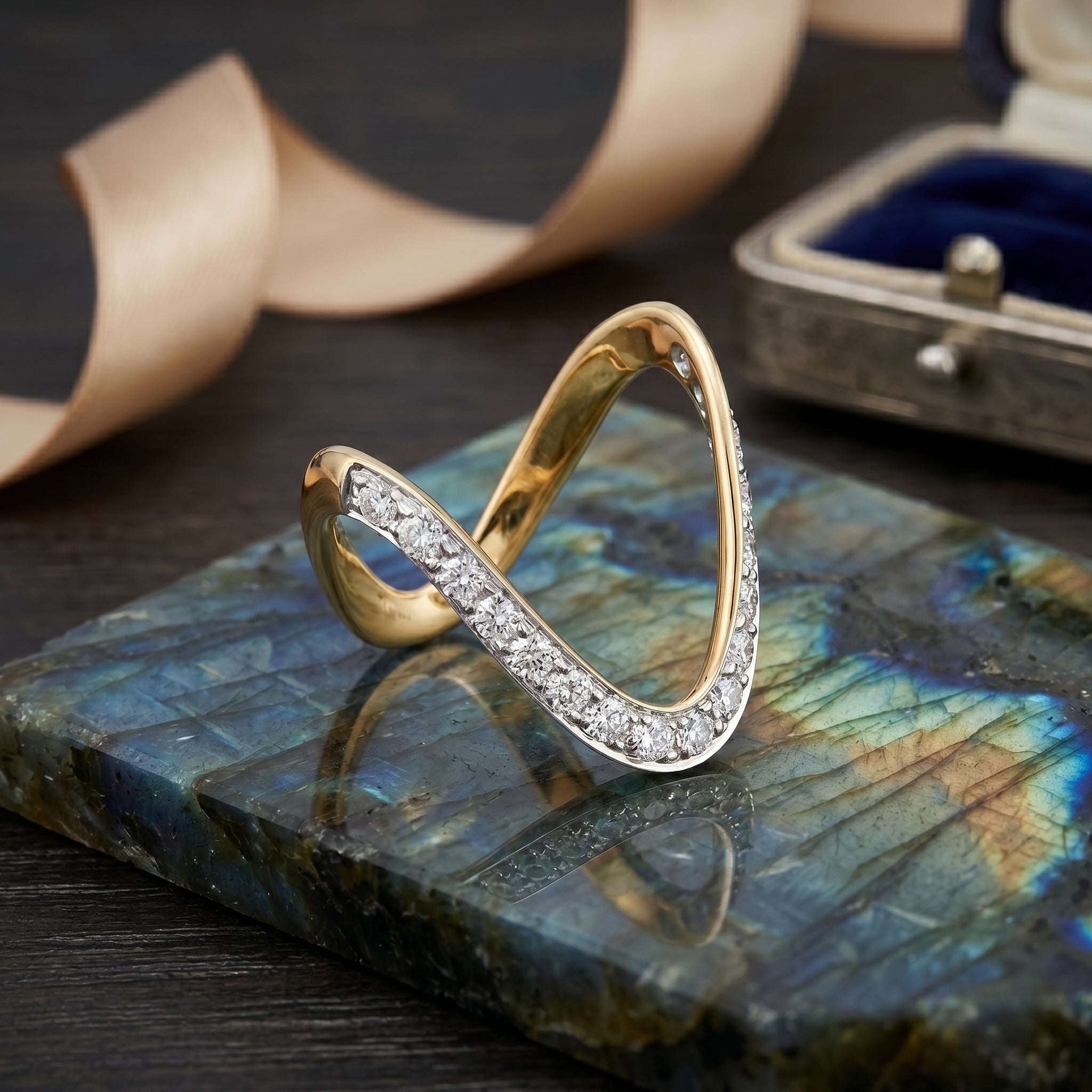 Gold ring with diamonds on a labradorite stone