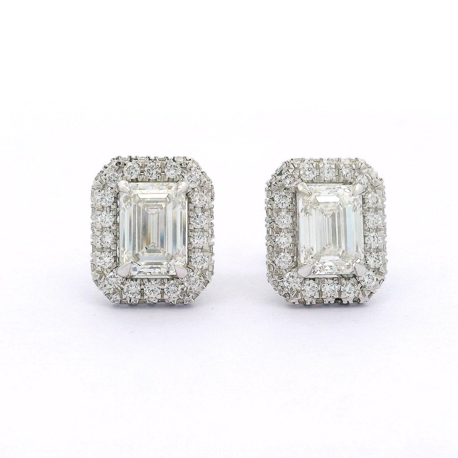 Pair of diamond earrings on a white background
