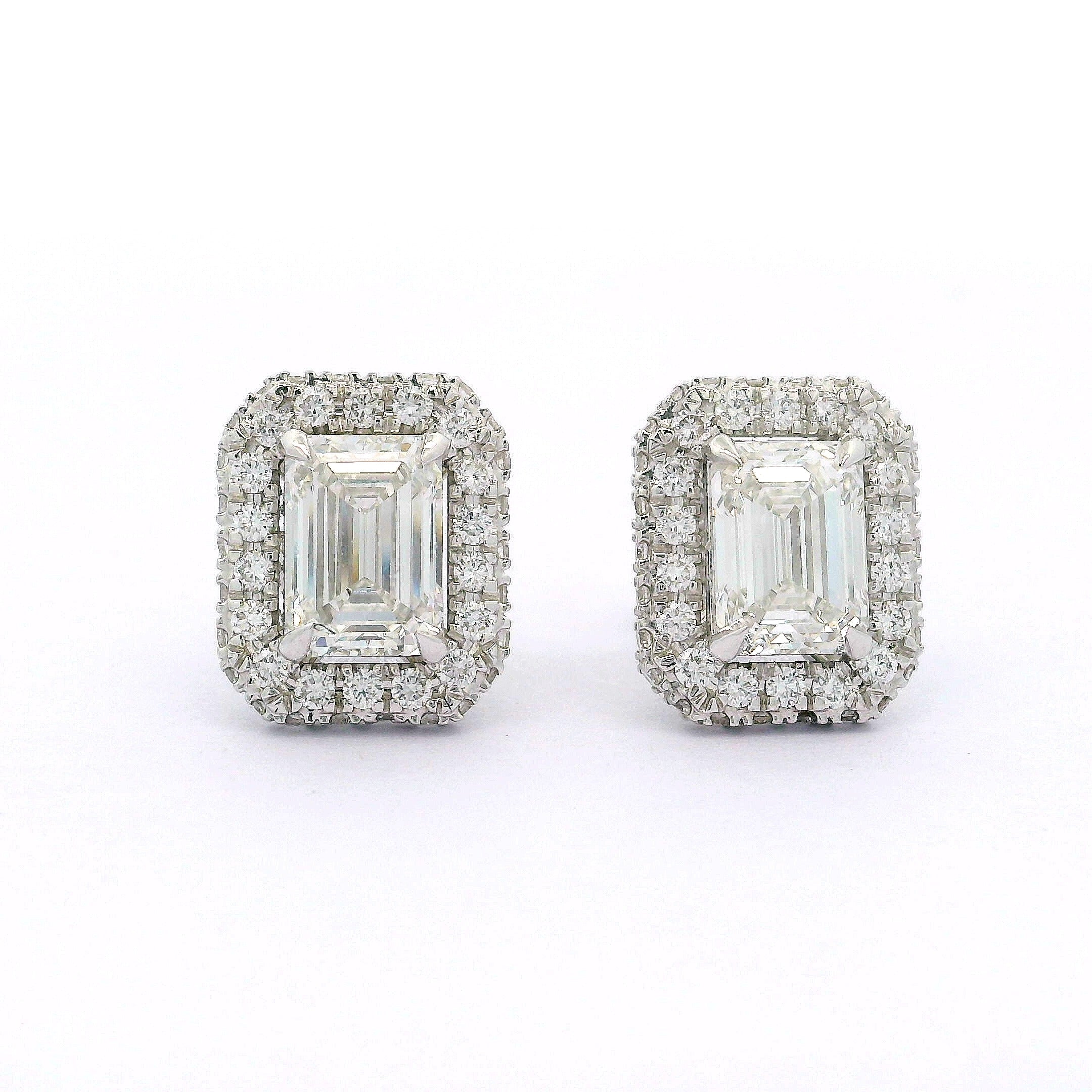 Pair of diamond earrings on a white background