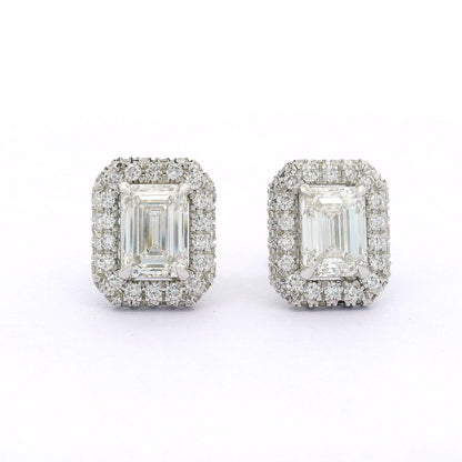 Pair of diamond earrings on a white background