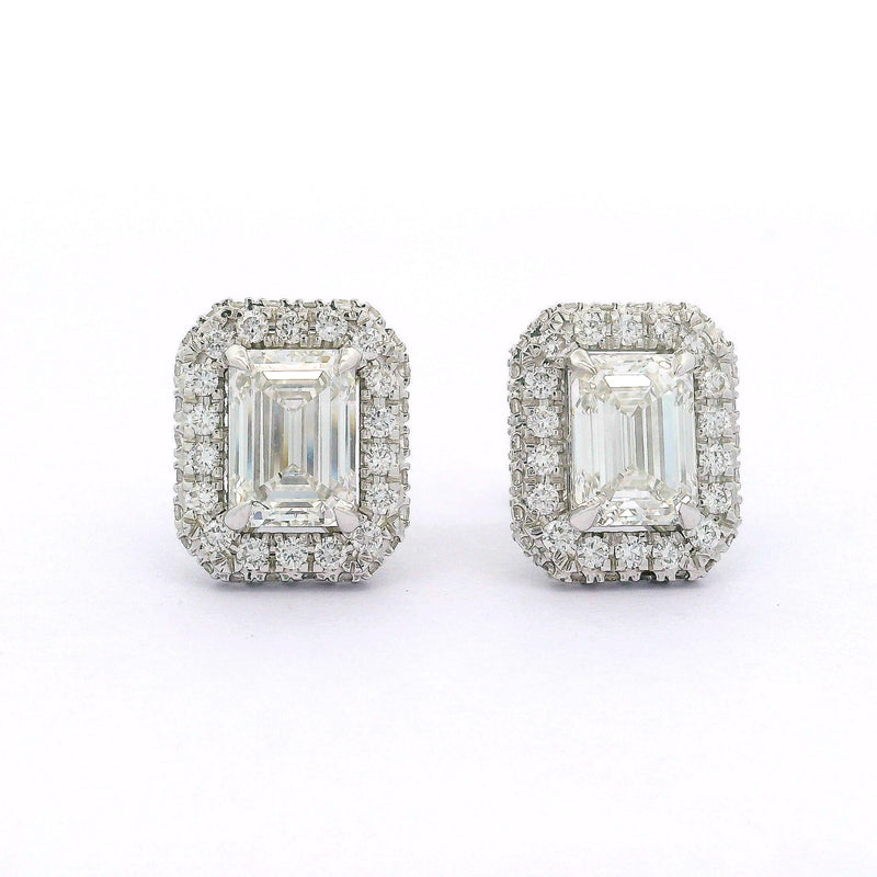 Pair of diamond earrings on a white background