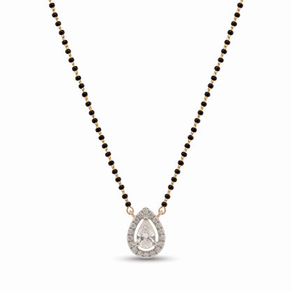 A teardrop-shaped pendant necklace featuring a clear pear-cut center stone surrounded by small clear stones, suspended on a black beaded chain with rose gold-toned accents, shown on a plain white background.