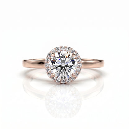 Rose gold ring with a large diamond on a white background