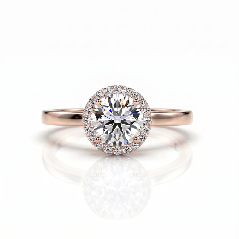 Rose gold ring with a large diamond on a white background