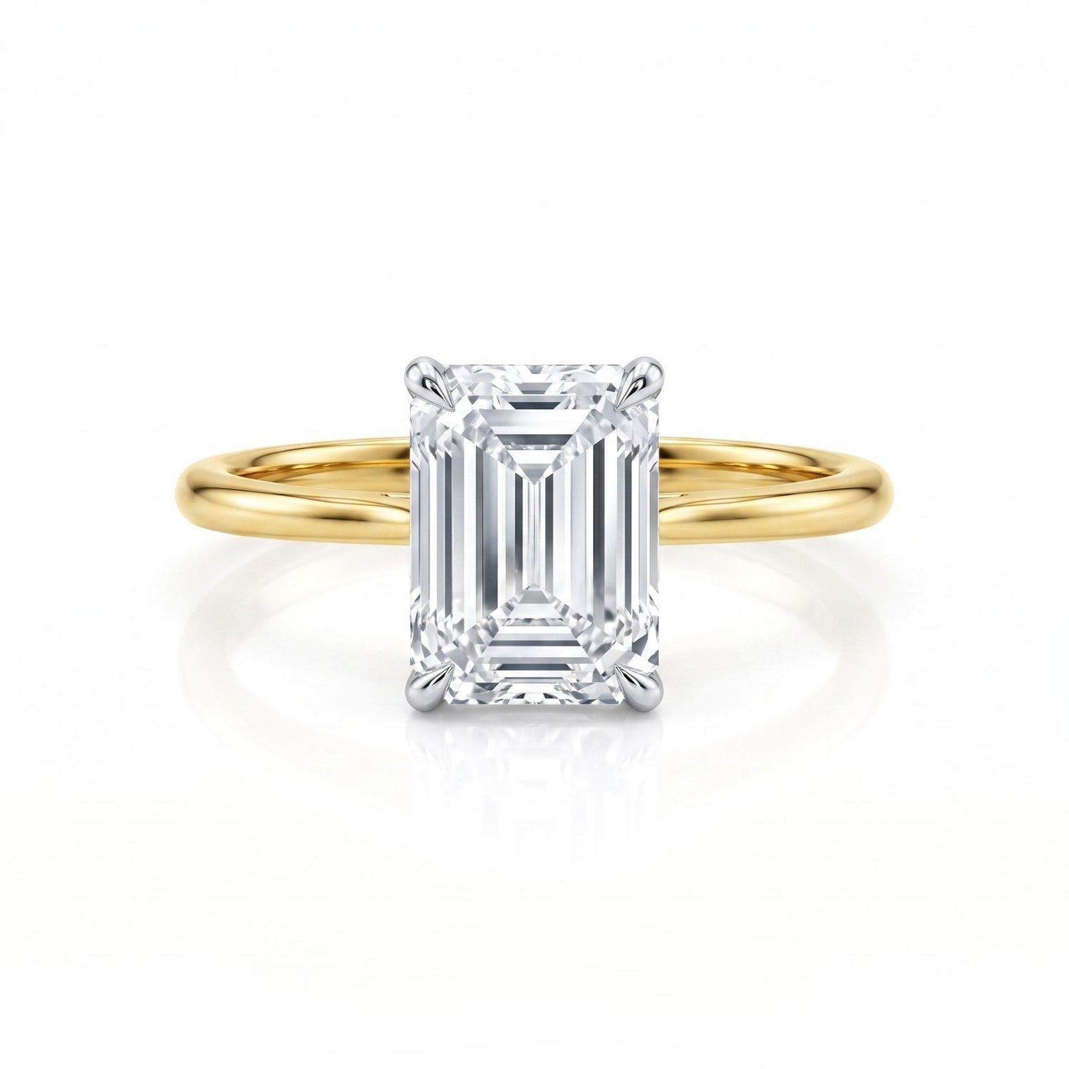 Gold ring with a large diamond on a white background