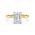 Gold ring with a large diamond on a white background