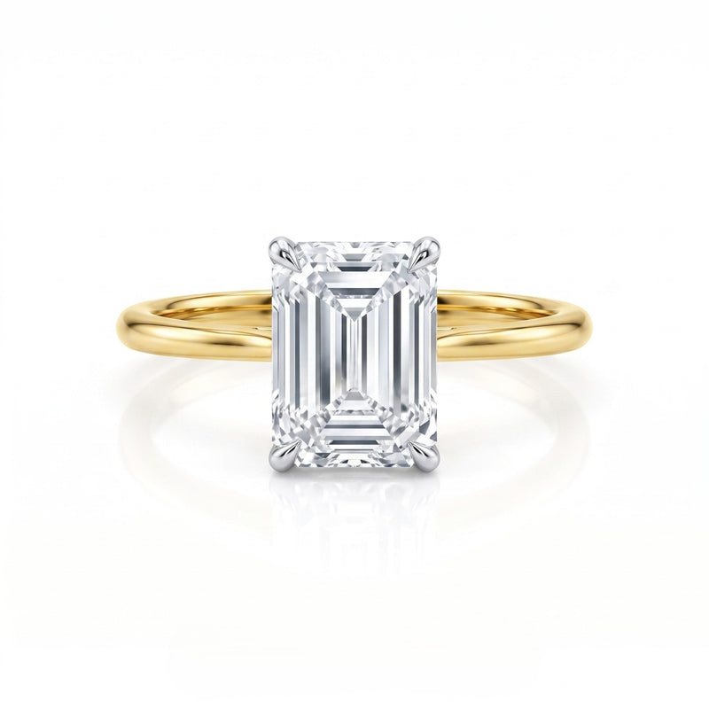 Gold ring with a large diamond on a white background