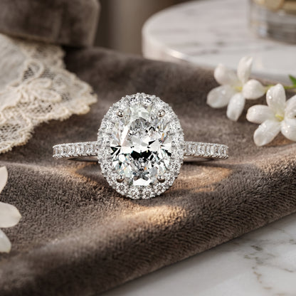 Diamond ring on a textured surface with flowers