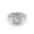 Diamond ring with a central emerald-cut gemstone on a white background